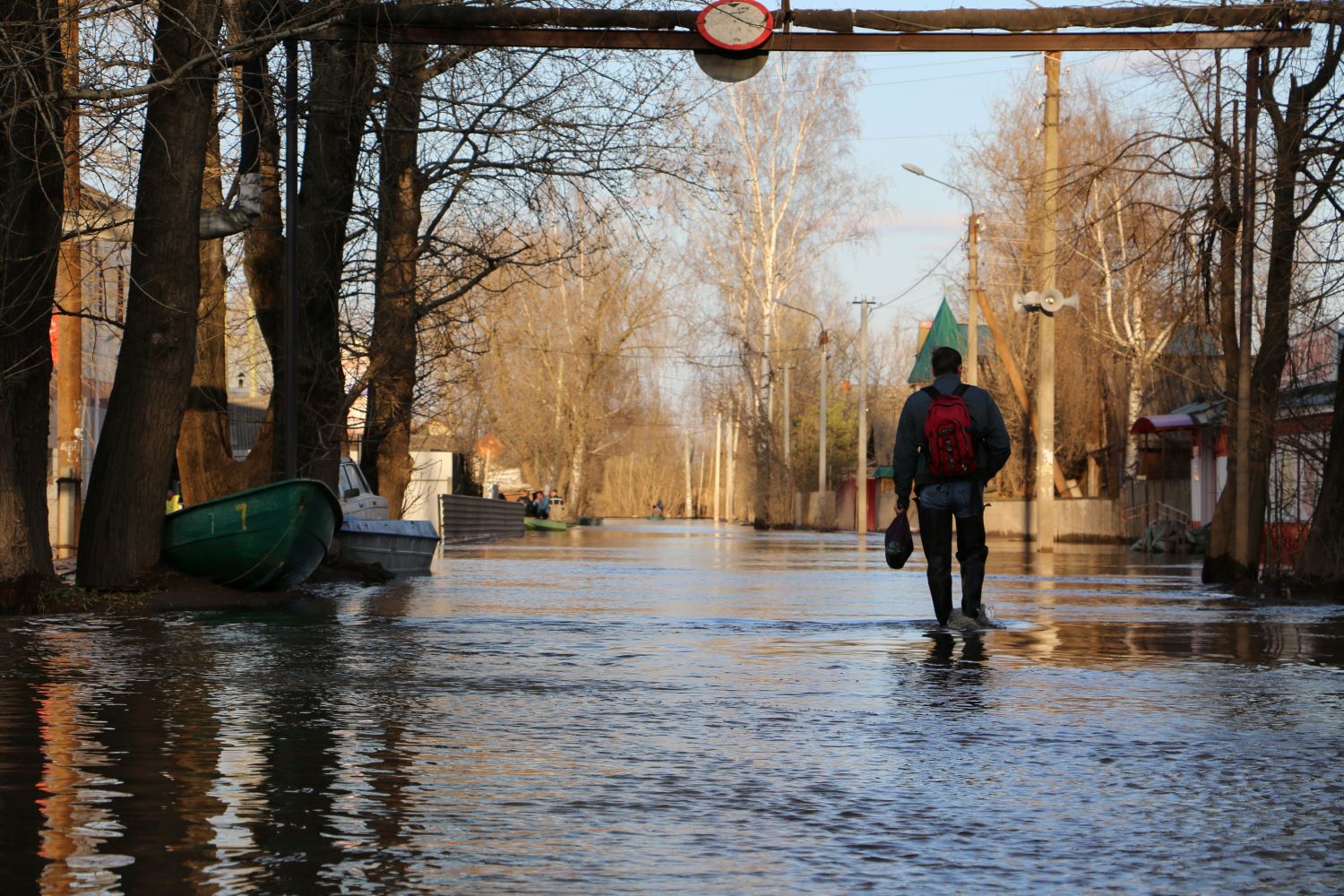 Image of man surrounded by flooded area