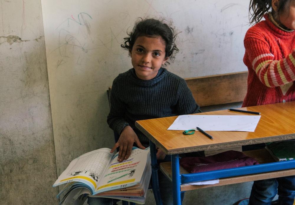 A girl who is a refugee in Lebanon, at a school supported by the Luminos Fund. Photo by Luminos Fund.
